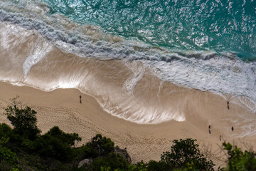 Aerial Top-Down View of a Beach with Gentle White Foamy Waves High quality photo