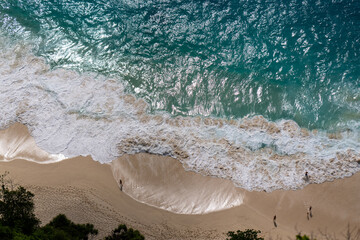 Aerial Top-Down View of a Beach with Gentle White Foamy Waves High quality photo