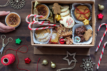 A collection of delicious baked goods in a homemade cookie box for the holidays.