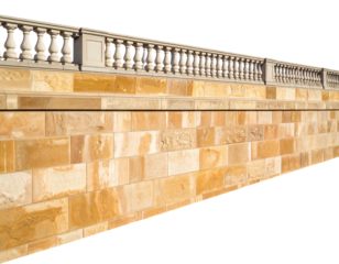 Architectural element featuring a sandstone wall and balustrade in bright sunlight