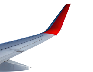 Close-up of a jet's wing with a vibrant red and blue fin against a stark black background
