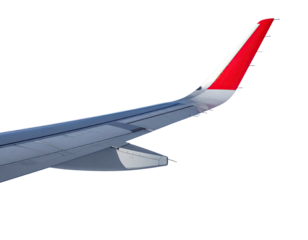 Close-up of an airplane wing with a red and white tip against a black background