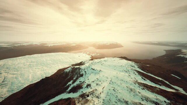 tundra ridge dusted with snow at sunrise, rugged terrain rising from icy plain, long shadows, crisp air, sense of exploration and remote wildness