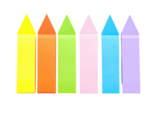 A collection of six colorful, triangular-tipped, rectangular adhesive notes arranged closely