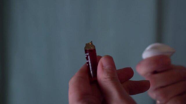 opening the ampoule with medicine for medical injection with a disposable forceps at home