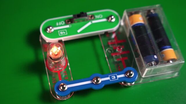 Learn how to connect a simple circuit to light up a bulb using batteries