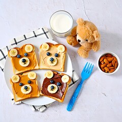 Cute bear shaped toast with banana and blueberries on a plate