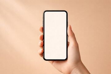 Hand holding a mobile phone with a white blank screen against a plain beige background for minimalist app design presentation and digital interface mockups