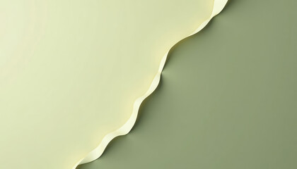 Top view of pale yellow and green background separated by wavy white ribbon