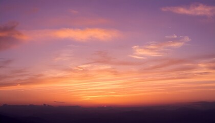 Fototapeta premium Soft Pastel Sunset Sky With A Warm Orange Glow Fading Into Light Purple