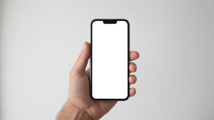 Hand holding smartphone with blank screen in modern minimalist style with soft natural lighting for mobile app mockup
