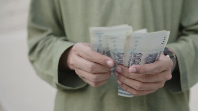 Pakistani Currency Transaction &ndash; Counting Cash in Hands