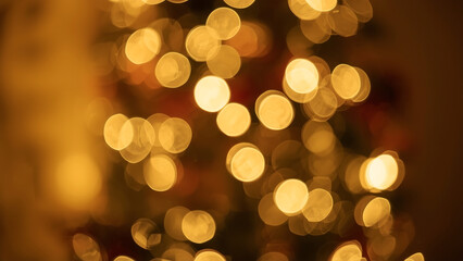 Obraz premium Golden Bokeh Lights Abstract Background with Warm Glow and Blurred Texture