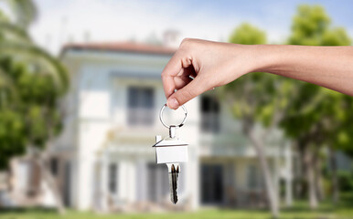 hand holding keys for real estate