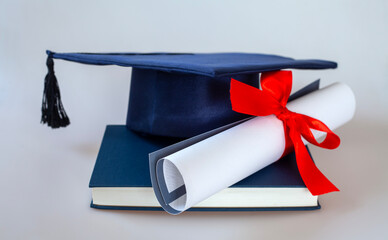 graduation cap and diploma