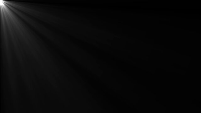 Black background with spotlight shining from left corner light rays dark white light