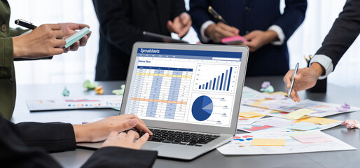 Analyst team use sticky note for creative and analytic brainstorm for business idea with BI data dashboard on laptop screen. Analysis financial data visualization tech for marketing strategy. Prodigy
