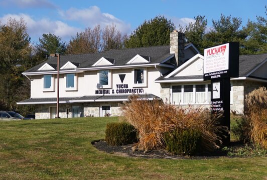 Bechtelsville, Pennsylvania, U.S - Dec 6, 2025 - Yucha Medical and Chiropractic, offering weight loss, aesthetics, and disc decompression services in a landscaped building.