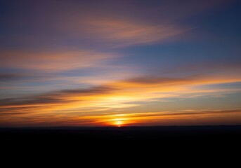 Fototapeta premium Tranquil evening sky silhouette at dusk, featuring a serene landscape during the golden hour with stunning natural colors and a peaceful horizon view, beautiful, wilderness, idyllic