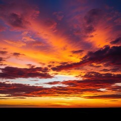 Fototapeta premium Vibrant, spectacular evening atmosphere with colorful, painterly clouds during a dramatic golden hour sunset over the vast horizon, idyllic, golden hour, colorful