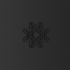 Christmas black star ornament on dark background.
