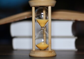 Globe hourglass and books symbols of time adventure knowledge	
