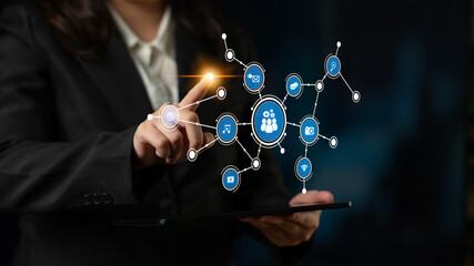 A business professional engages with a digital connection network on a tablet, illustrating modern technology and collaborative marketing strategies in action. Tessel