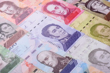 Obraz premium Venezuelan bolivar, cash, currency of Venezuela, banknotes for transactions. Venezuelan bolivar