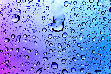 Glass surface with water drops, closeup view