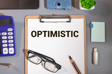 Businessman turns cubes and changes the word 'pessimist' to 'optimist'.