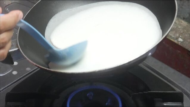 the process of making risol skin food in a Teflon pan made from wheat flour dough