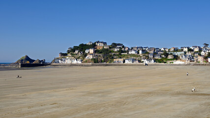 Beach at low tide  with the chapel Saint Michel in the background at Pleneuf Val Andre, is a commune in the C&ocirc;tes-d'Armor department of Brittany in northwestern France 