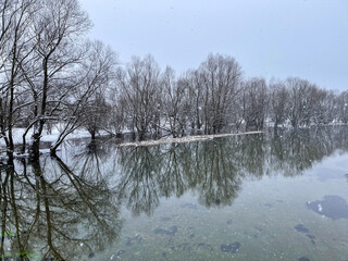 Scenic Wide Angle View of Flooded Winter River and Forest. High quality photo