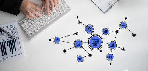 Modern digital network visualization depicting business icons with keyboard interaction, illustrating data analysis and strategic planning in a corporate setting. Tessel