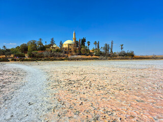Naklejka premium The mosque on the edge of the Larnaca Salt Lake is the Hala Sultan Tekke. It is one of the most important holy sites in the Muslim world.