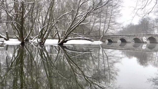 Aerial view of mountain lake at winter with snow. High quality 4k footage