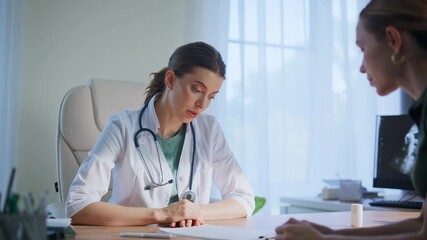 Doctor providing medical advice to clinic patient. Therapist discuss treatment