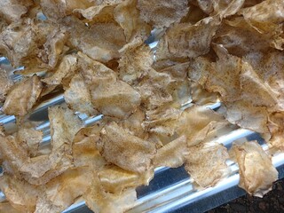 Drying raw Jengkol crackers in The Yard