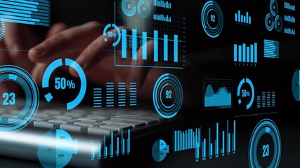 A close-up image of hands typing on a keyboard surrounded by digital graphs and charts, illustrating data analysis and technology in a modern workspace environment. Xenic - Powered by Adobe