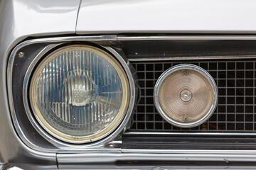 Head lamps with garnish moldings of a classic car