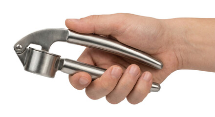 Hand holding metal garlic press
