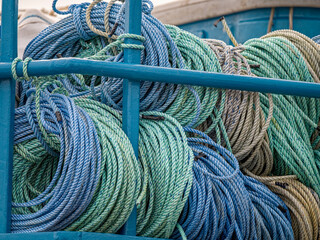 Colorful coils of rope stored on a fishing boat