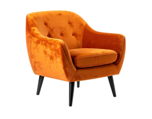 A vibrant, tufted orange velvet armchair with black wooden legs isolated on a black background