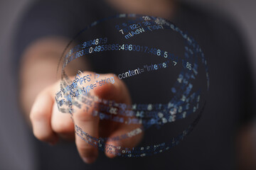 Abstract image of a hand interacting with a digital data sphere, representing technology, internet, and communication. Perfect for il