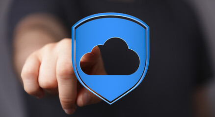 Secure cloud data storage concept with hand pointing to a blue shield with a cloud inside, representing protect