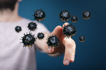 Concept of health and disease control with digitally rendered virus. Hand touching particles, representing the