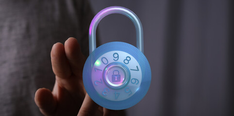 Secure your data with this futuristic digital security concept. A glowing padlock is held by a hand, symbolizing protection, privacy,
