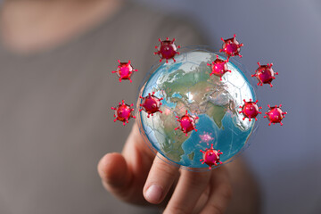 Visual representation of the coronavirus outbreak: Earth globe surrounded by virus particles, symbolizing glob
