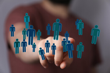 Visual representation of connection, teamwork, and networking with digital human icons forming a network. Symbo