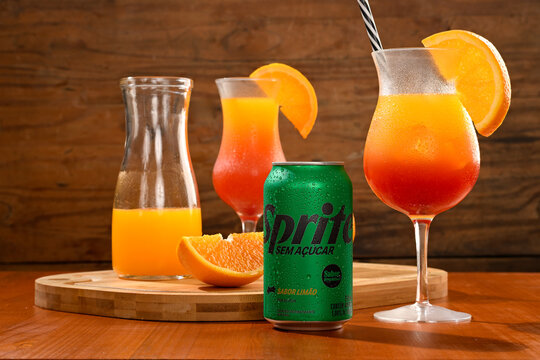 S&atilde;o Paulo, Brazil - December 19, 2025 - Refreshing Sprite Zero Sugar cocktails with orange juice and grenadine, layered drink.